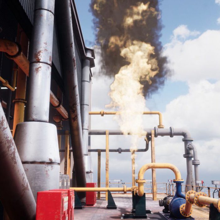 A large industrial facility emitting a significant cloud of black smoke and flames from a pipe structure, surrounded by yellow and silver pipes, under a partly cloudy sky.
