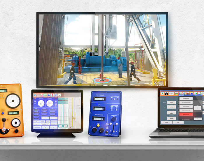 Un escritorio muestra un monitor con una escena industrial, junto a un dispositivo naranja, una tableta con una pantalla azul, un dispositivo azul con mandos y un ordenador portátil con una interfaz cuadriculada.