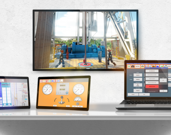 En un escritorio hay una tableta, dos monitores y un ordenador portátil que muestran varias interfaces técnicas y un vídeo de una planta industrial en una pantalla mural.